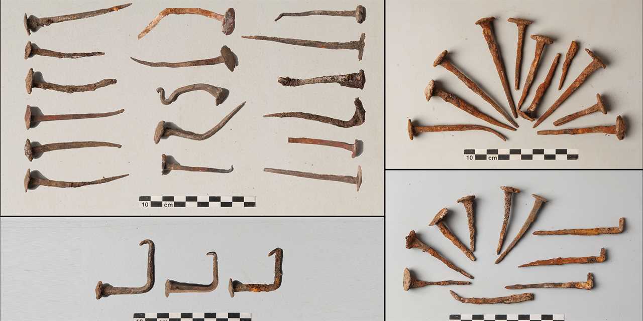 Nails of different shapes are laid out on a white background. Some are bent or twisted, suggesting they were imbued with "magical properties"