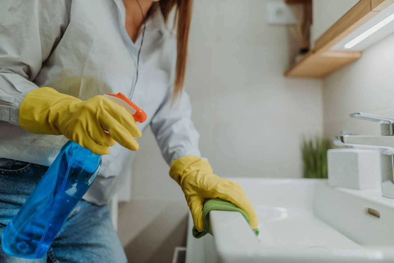 Cleaner using a dish soap homemade cleaning solution from natural products in a spray bottle to clean surfaces