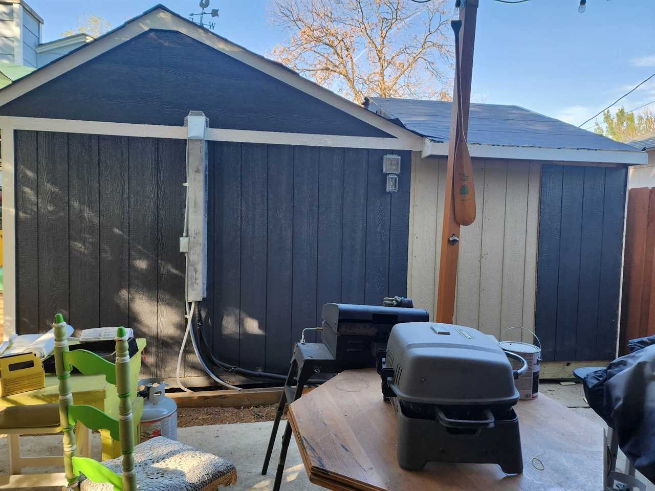 Shed being painted blue