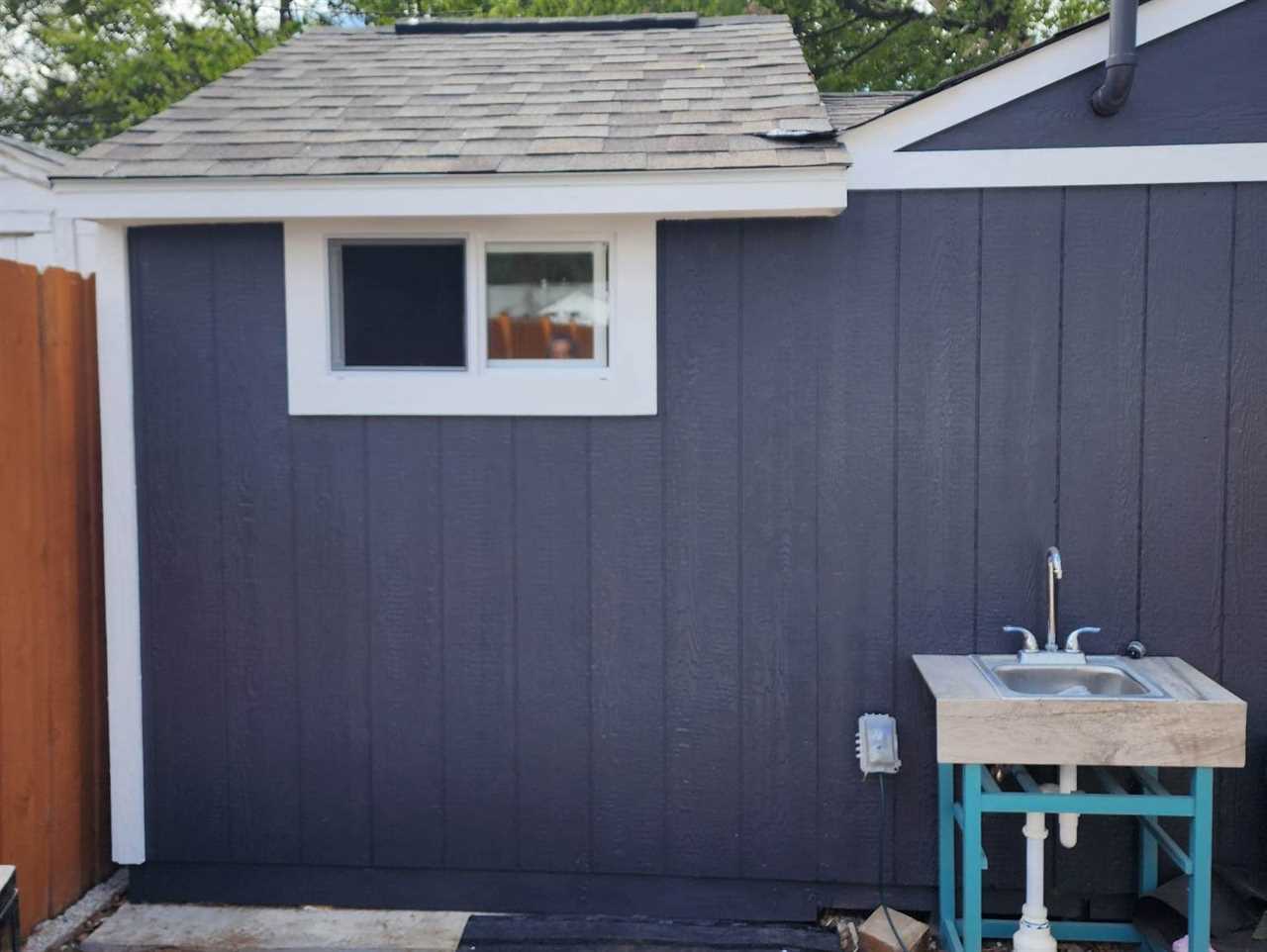 Shed being painted blue