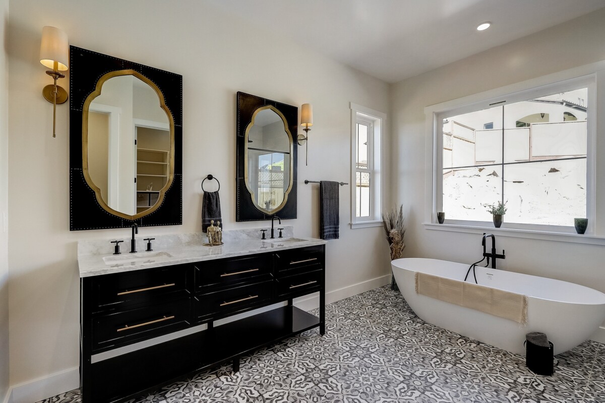 remodeled bathroom dark accents and gold finishes