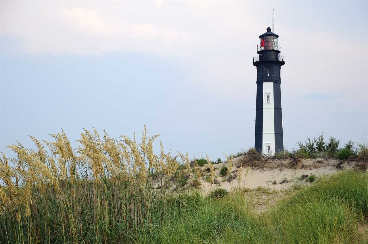 View of the Cape Henry Lighthouse from the grassy shore of the Chesapeake Bay, Fort Story, VA