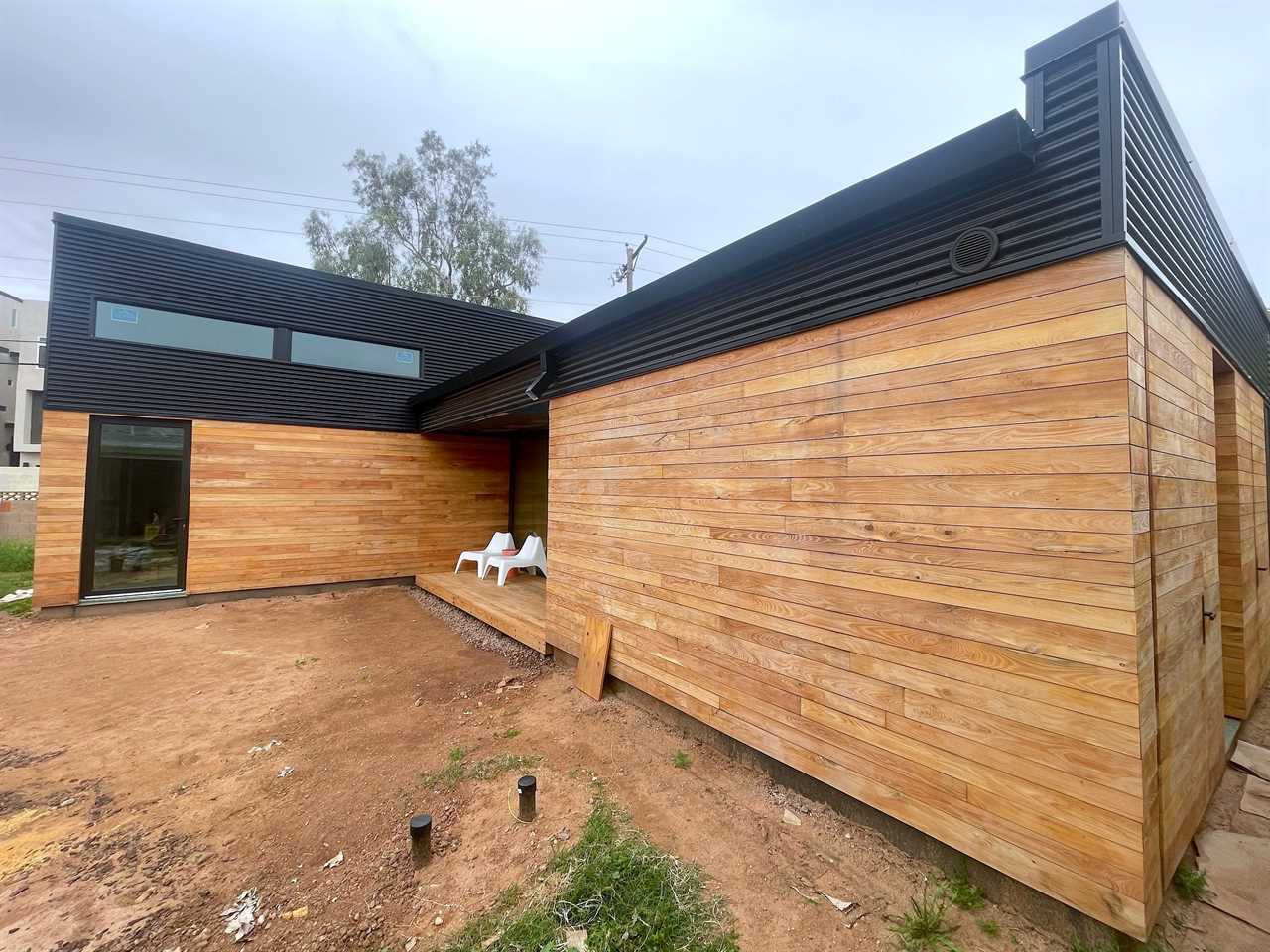 A new house with wooden exterior siding.