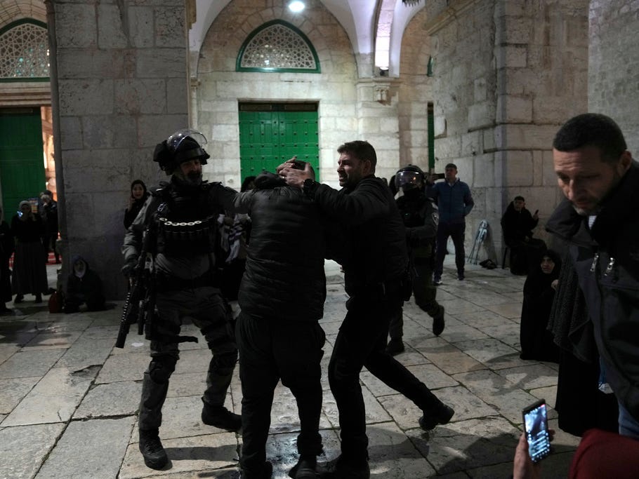 Israeli police detain a Palestinian worshipper at the Al-Aqsa Mosque compound in the Old City of Jerusalem during the Muslim holy month of Ramadan, Wednesday, April 5, 2023.