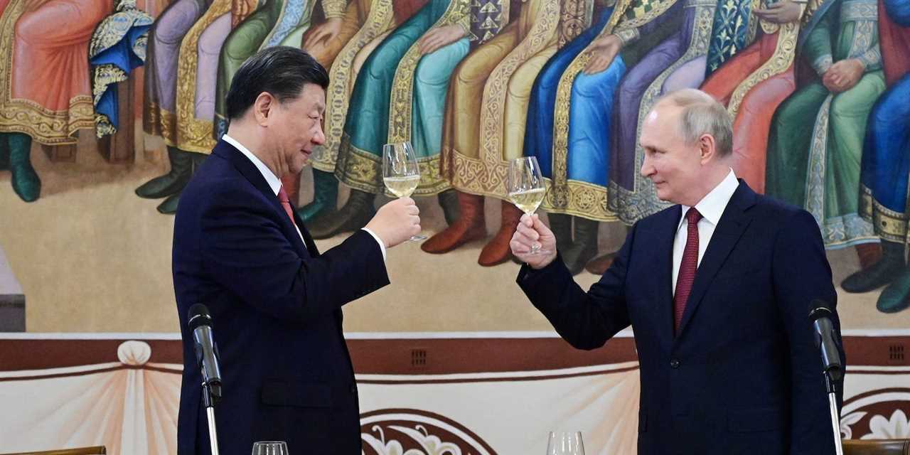 Russian President Vladimir Putin and Chinese President Xi Jinping attend a reception at the Kremlin in Moscow, Russia March 21, 2023.