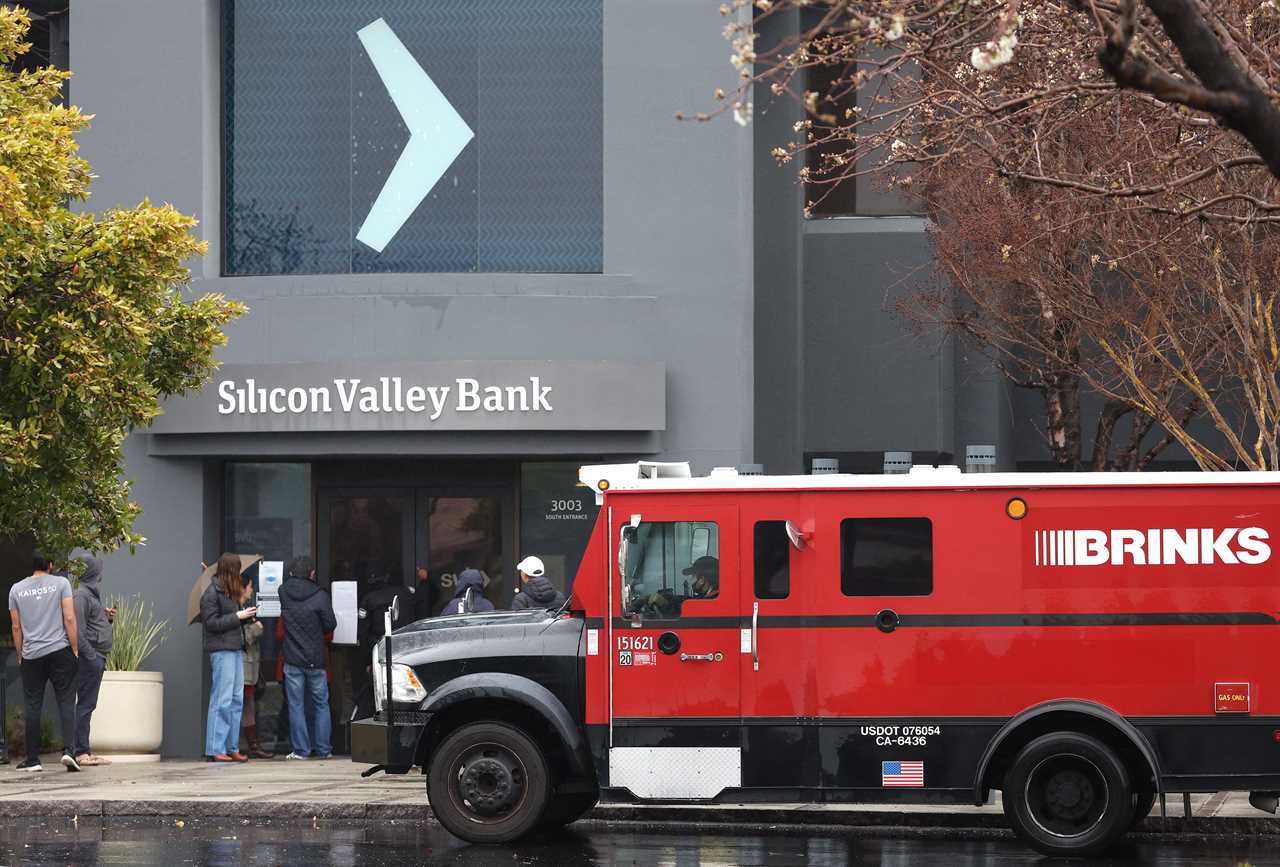 A Brinks armored truck sits parked in front of the shuttered Silicon Valley Bank (SVB) headquarters on March 10, 2023 in Santa Clara, California.