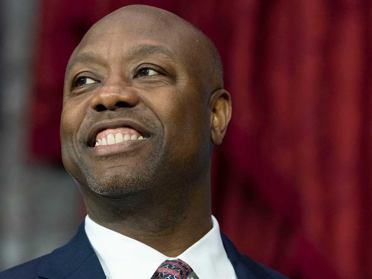 Republican Sen. Tim Scott of South Carolina participates in his ceremonial swearing-in by Vice President Kamala Harris, in the Old Senate Chamber on Capitol Hill in Washington, Tuesday, January 3, 2023.