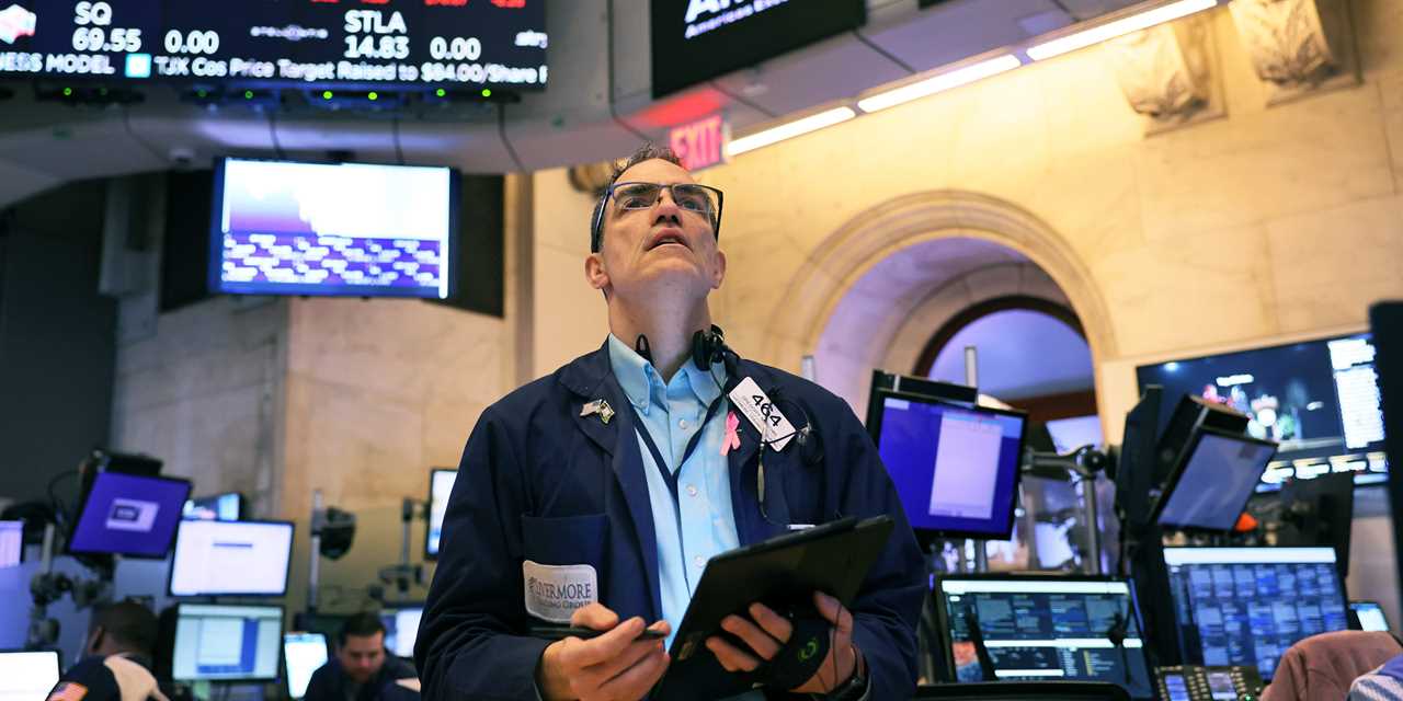 Stock trader Greg Rowe Traders works on the floor of the New York Stock Exchange during morning trading on November 17, 2022 in New York City.