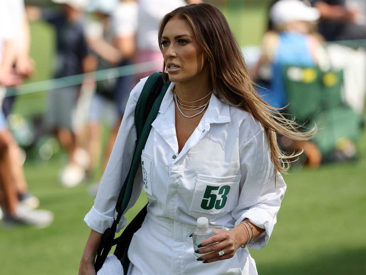 Dustin Johnson of the United States wife, Paulina Gretzky, looks on during the Par 3 contest prior to the 2023 Masters Tournament at Augusta National Golf Club on April 05, 2023 in Augusta, Georgia.