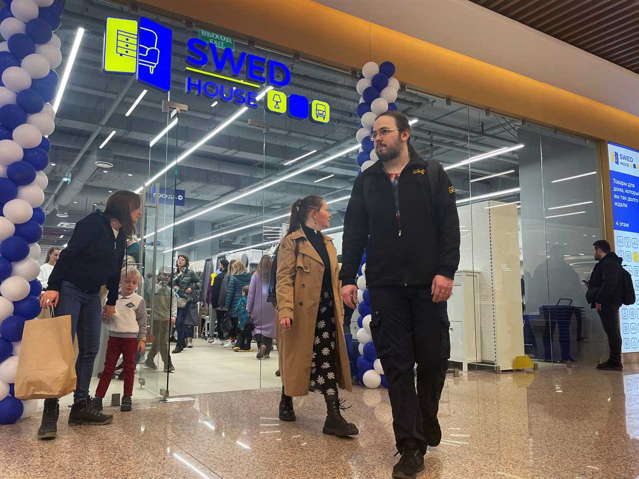 People leave a store of Belarusian retail chain Swed House on its opening day in Moscow, Russia April 15, 2023.