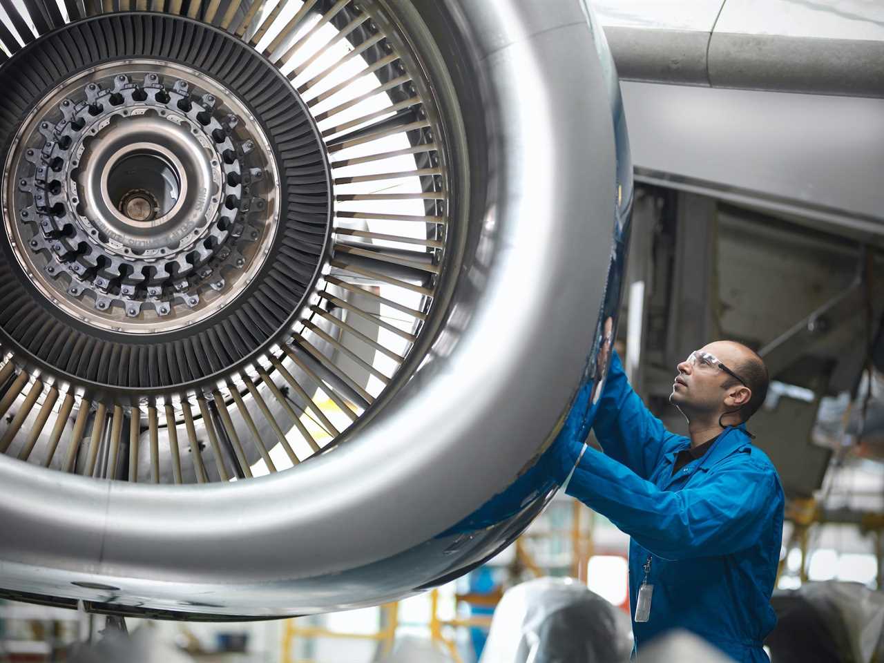 Aircraft engineer working on a jet engine