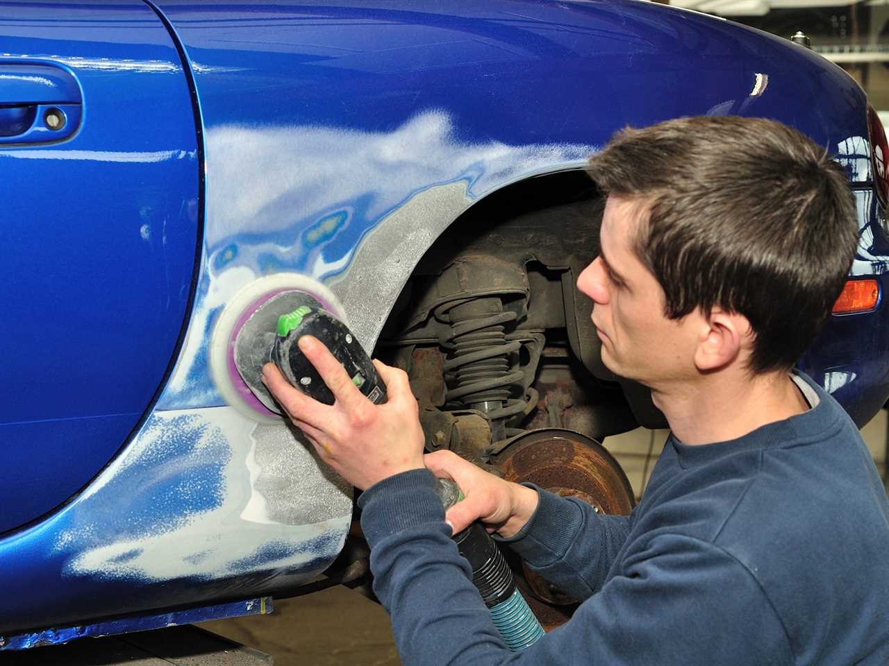 Person working on a car