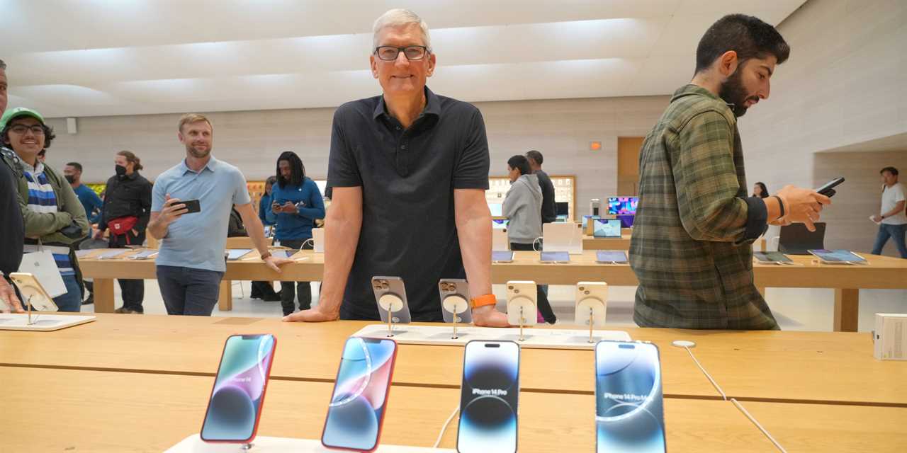 Tim Cook visits an Apple store in New York City on September 16.