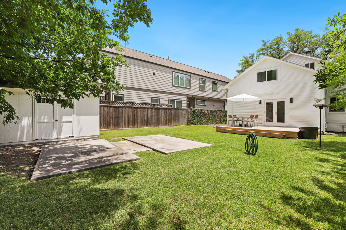 lush lawn backyard with storage shed