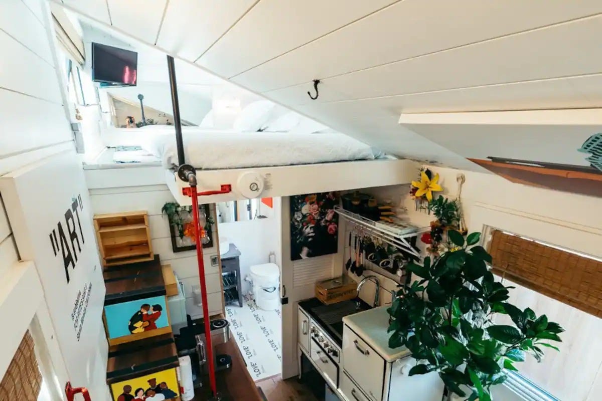 A small set of stairs leading to the upstairs sleeping space in Ansel Troy's Airbnb.