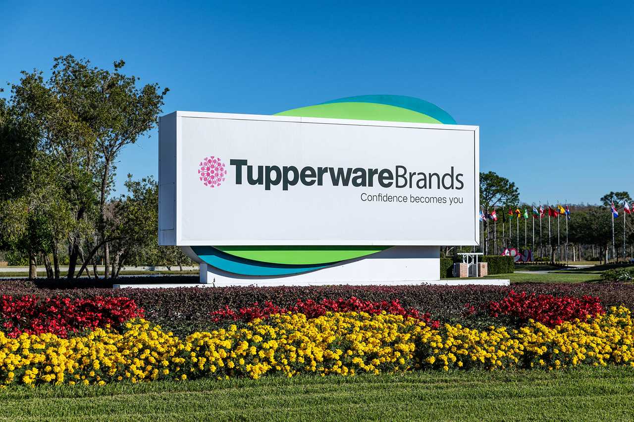 A sign outside of Tupperware's headquarters in Kissimmee, Florida. It includes the company's motto: "Confidence becomes you"