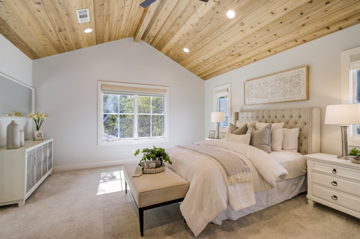 spacious primary bedroom recessed lighting