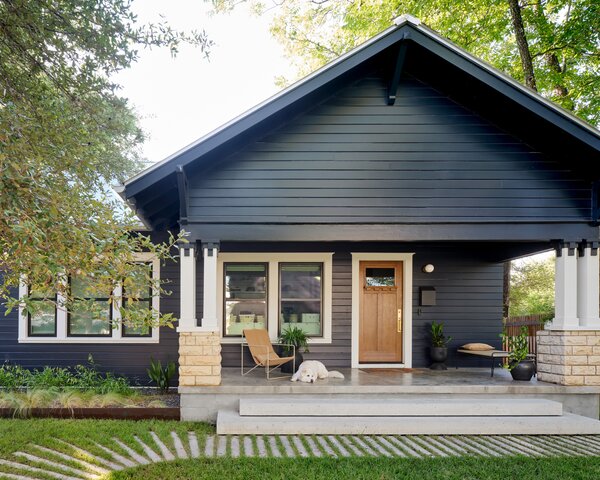 Gable in the front, party in the back. The designers preserved the facade of the original craftsman bungalow and added a new entry sequence, stairs, and porch surface.