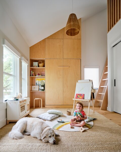 The living room once had low ceilings, but moving the insulation to the roof plane allowed for dramatic plays of volume and light.