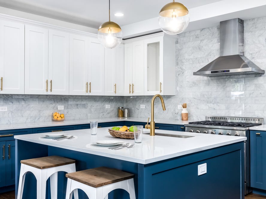 blue lower cabinets and white upper cabinets in kitchen