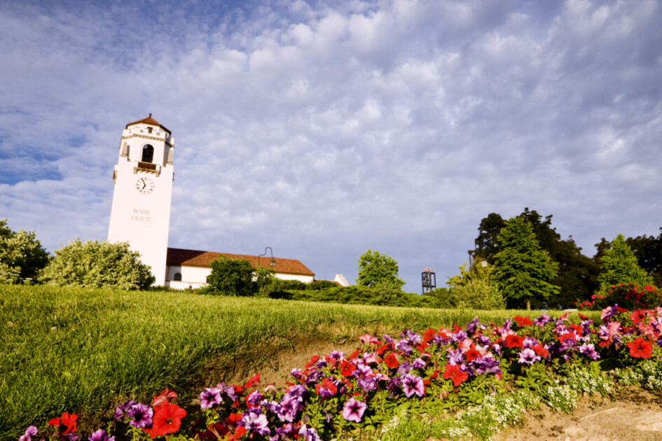 Boise Train Depot in Boise, Idaho, USA on a fine spring morning with spring flowers in the foreground