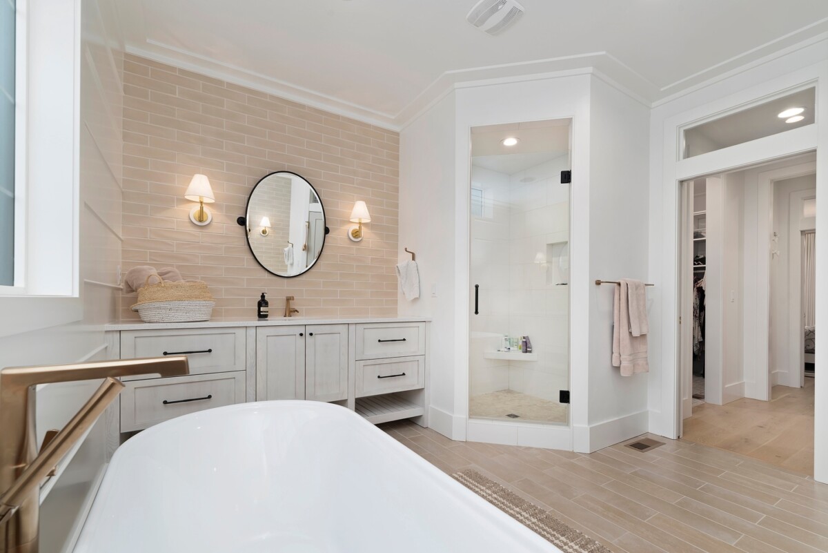 sleek bathroom with accent back splash and walk in shower