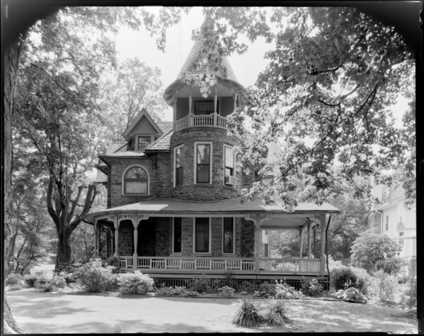 The 1890 Wallace Munn residence in Philadelphia features a wrap-around porch,