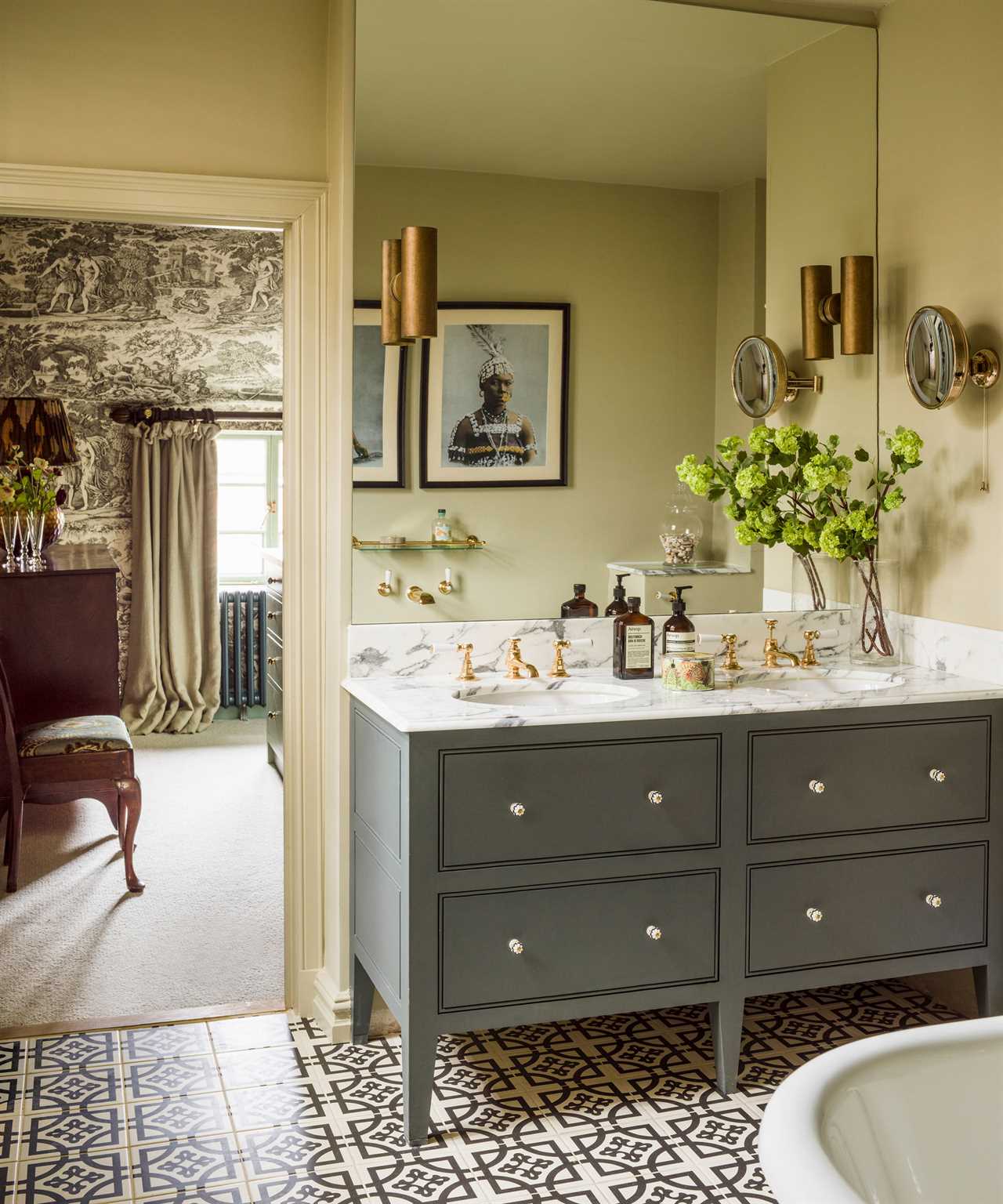 bathroom with blue cabinet under sink