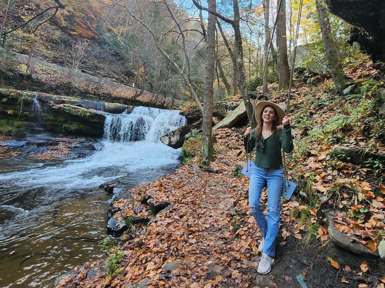 a woman walking through a forest