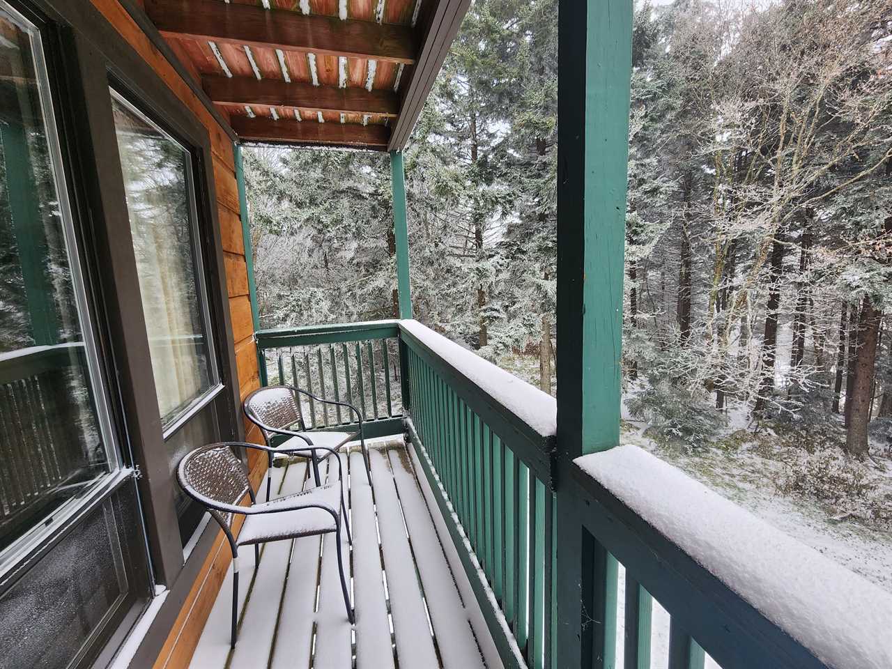 a balcony covered in snow