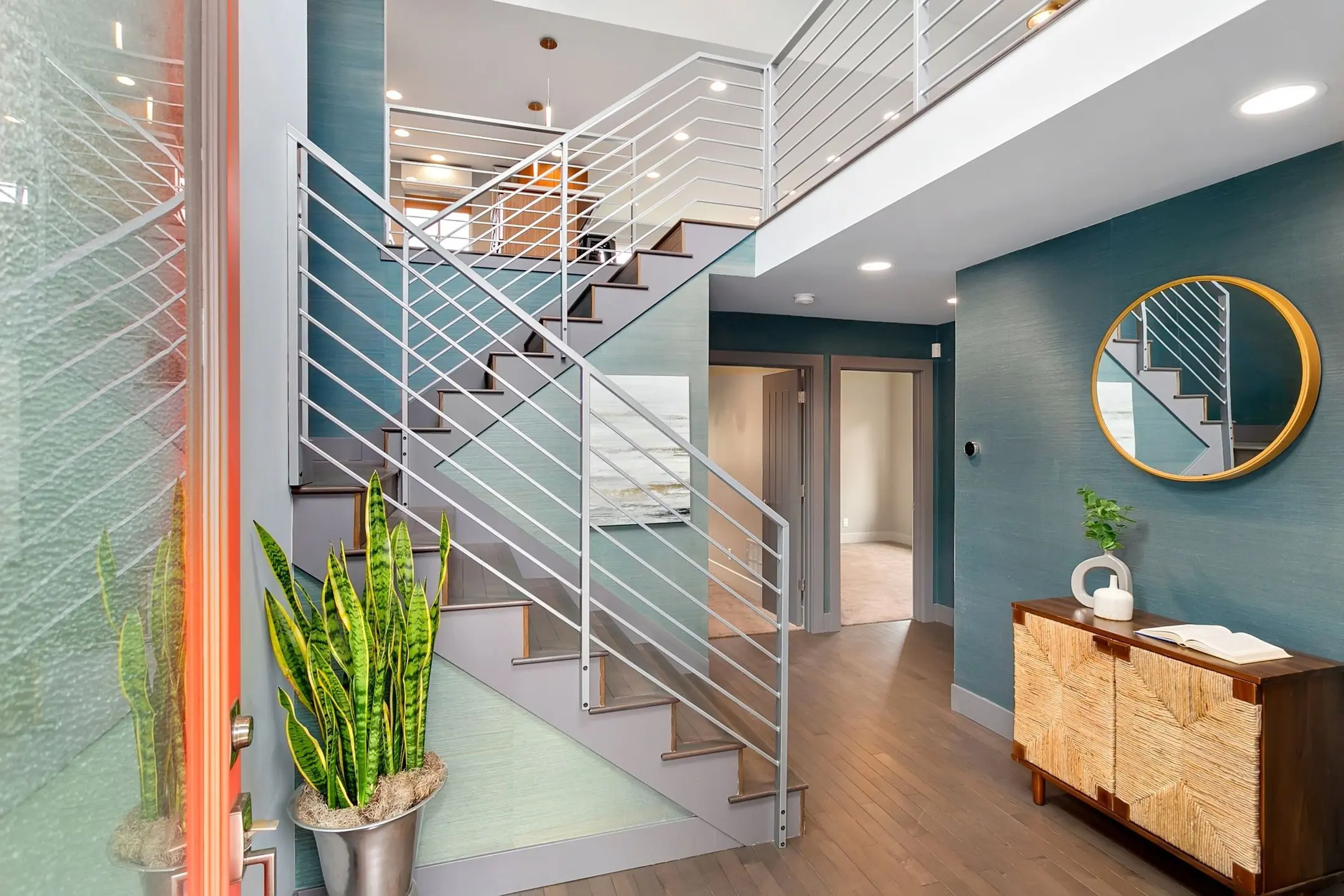 sleek metal stair case blue walls