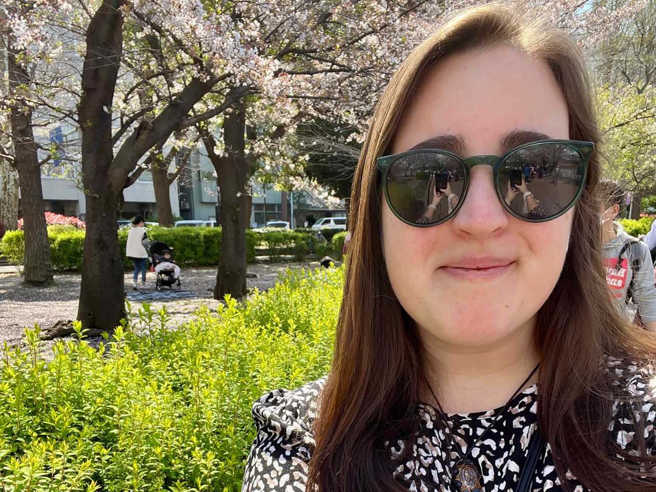 A selfie of the author with cherry blossoms in Tokyo.