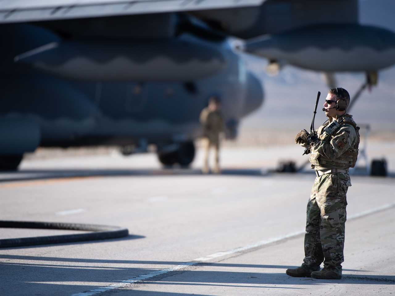 An Airman with Michigan Air National Guard’s 127th Wing observes a Forward Arming and Refueling Point (FARP) operation during Exercise Agile Chariot, on Wyoming Highway 287, April 30, 2023.