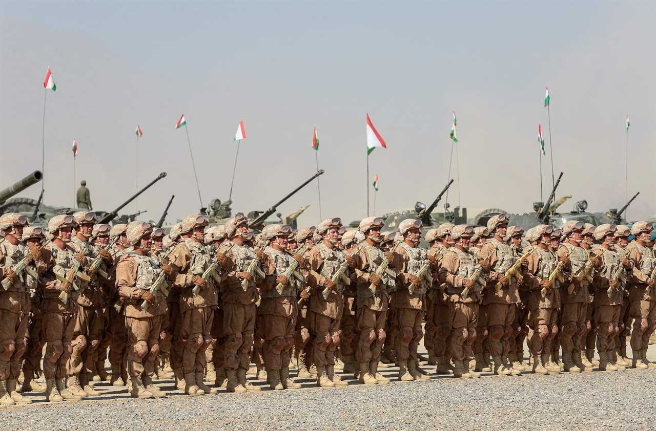 Russian service members line up during military drills carried out by the Russia-led Collective Security Treaty Organisation (CSTO) at the Harb-Maidon training ground, located near the Tajik-Afghan border in the Khatlon region, Tajikistan in October 2021.