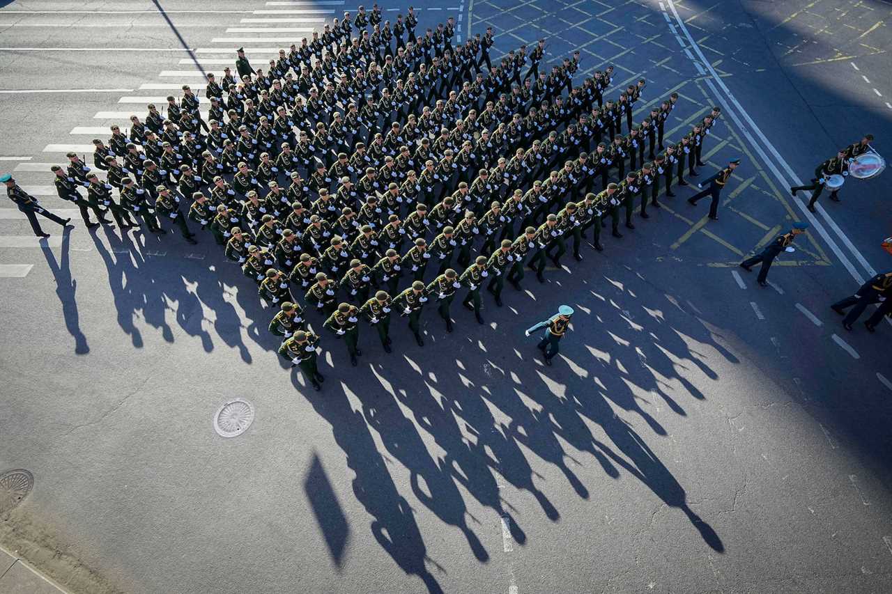 Russian soldiers march toward Red Square to attend a Victory Day military parade in Moscow, Russia, Tuesday, May 9, 2023.