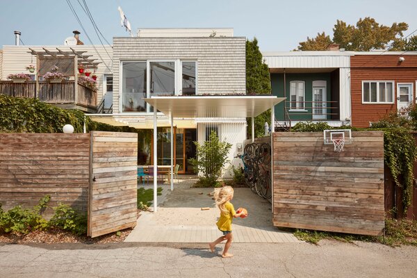 Mélanie Labrosse and Idir Saïdani’s Plateau-Mont-Royal home opens to the neighborhood with double gate doors.