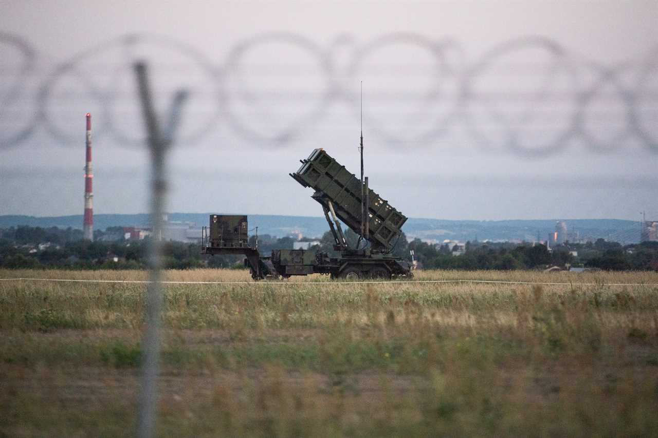 Patriot Missiles behind a barbed wire fence