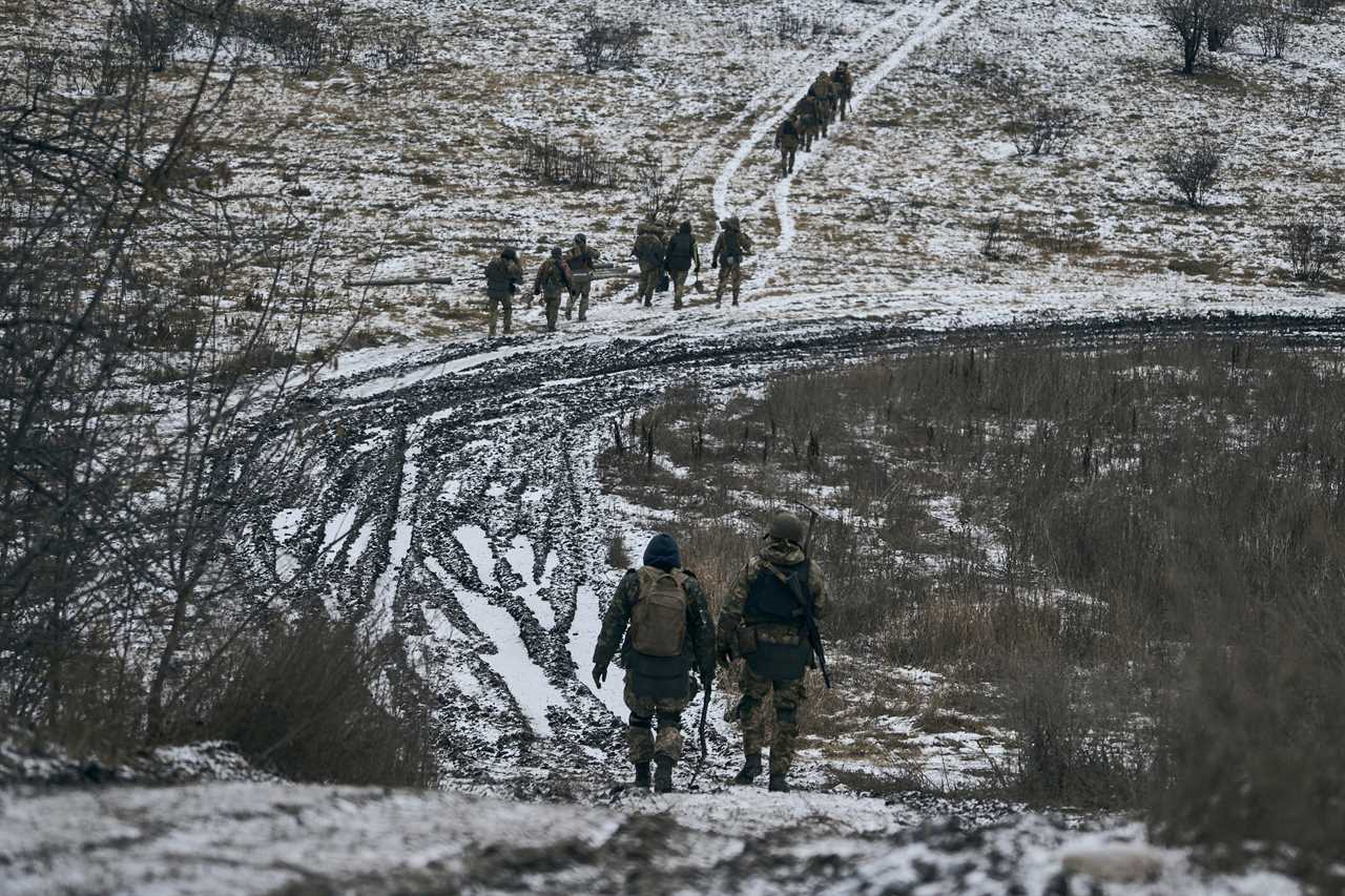 Ukrainian soldiers walk in the position close to Bakhmut, Ukraine, Thursday, Jan. 12, 2023.