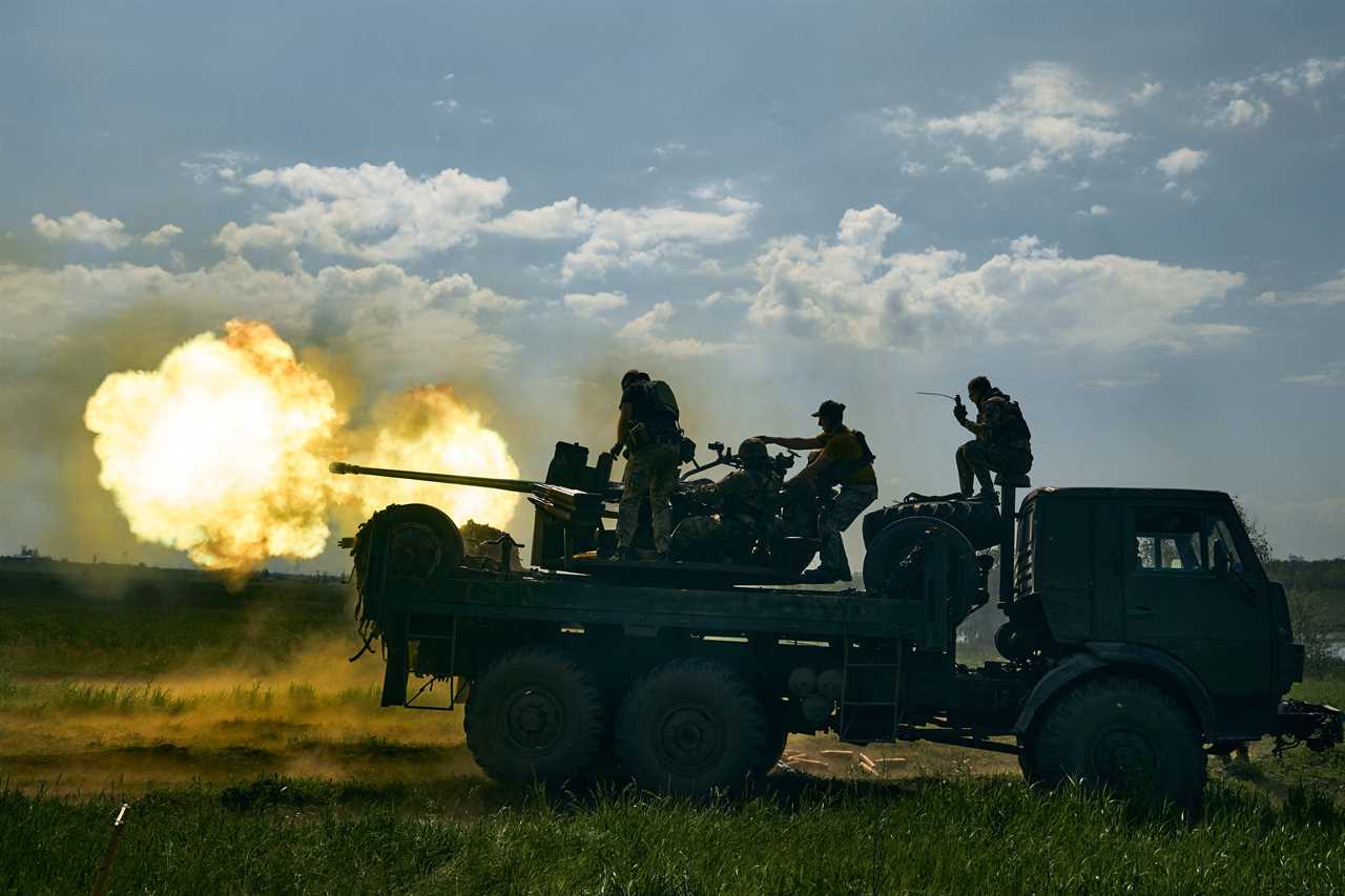 Ukrainian soldiers fire a cannon near Bakhmut, an eastern city where fierce battles against Russian forces have been taking place, in the Donetsk region, Ukraine, Monday, May 15, 2023.