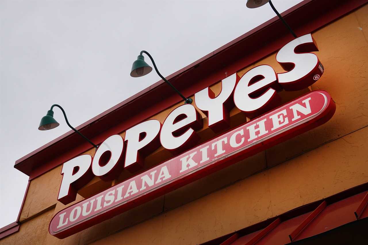 Sign on the exterior of a Popeyes restaurant