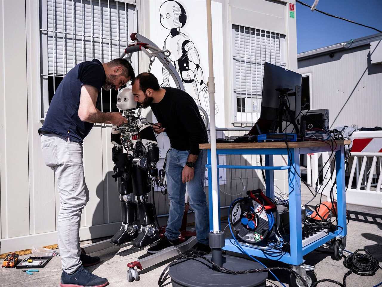 Engineers working on a robot