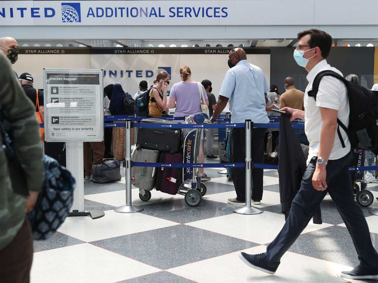 United Airlines passengers at the ticket counter.