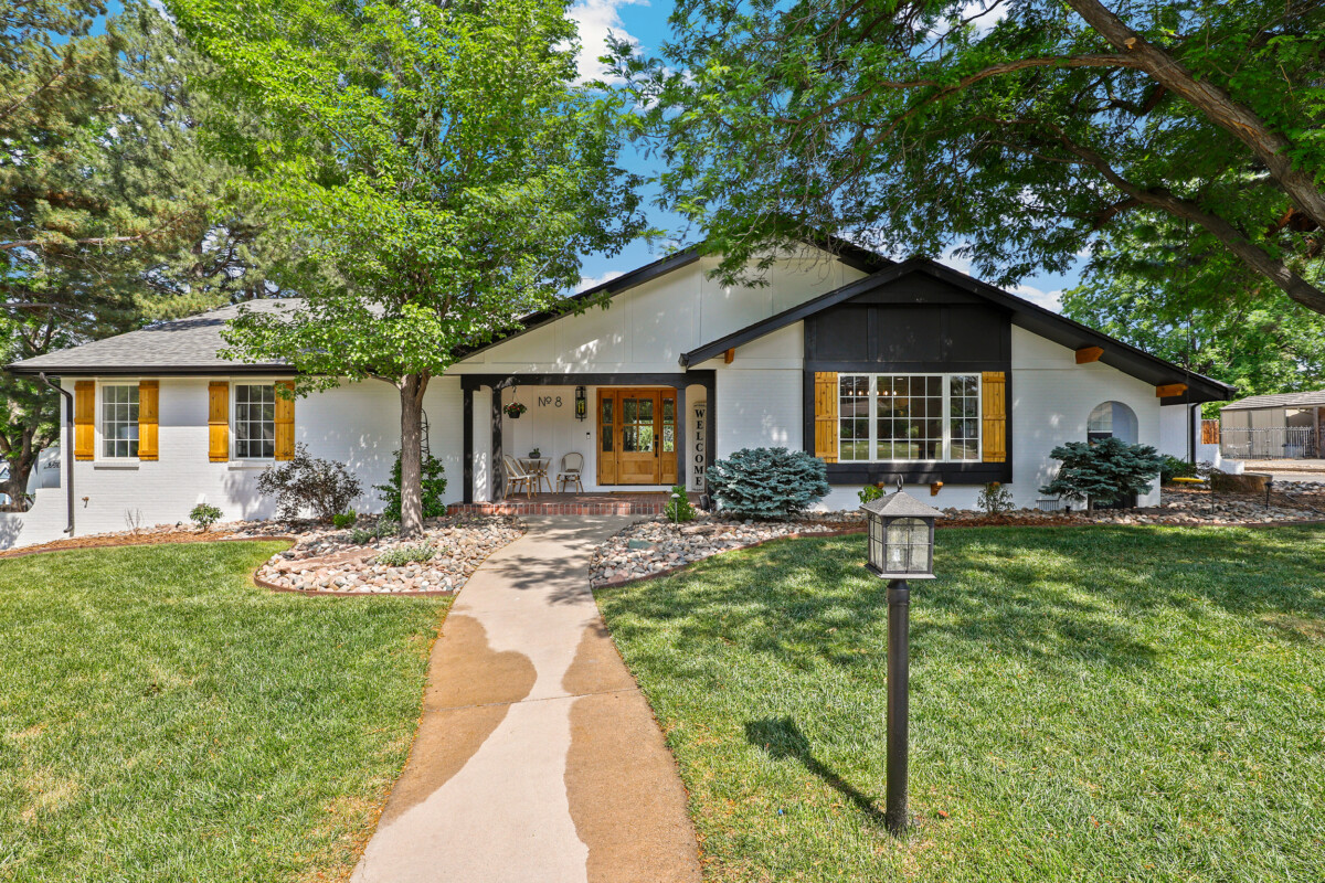 ranch home with trees and contrasting trim