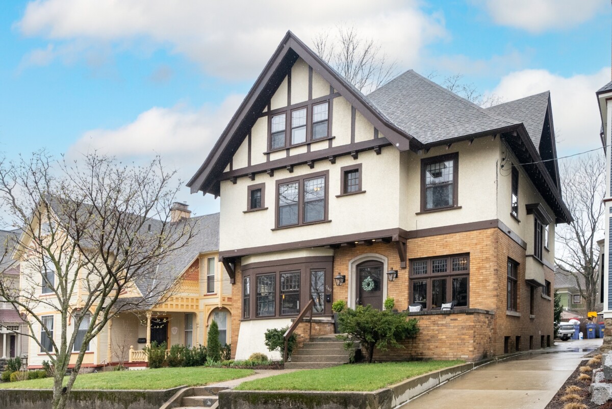 tudor home in massachusetts with white and brick exterior