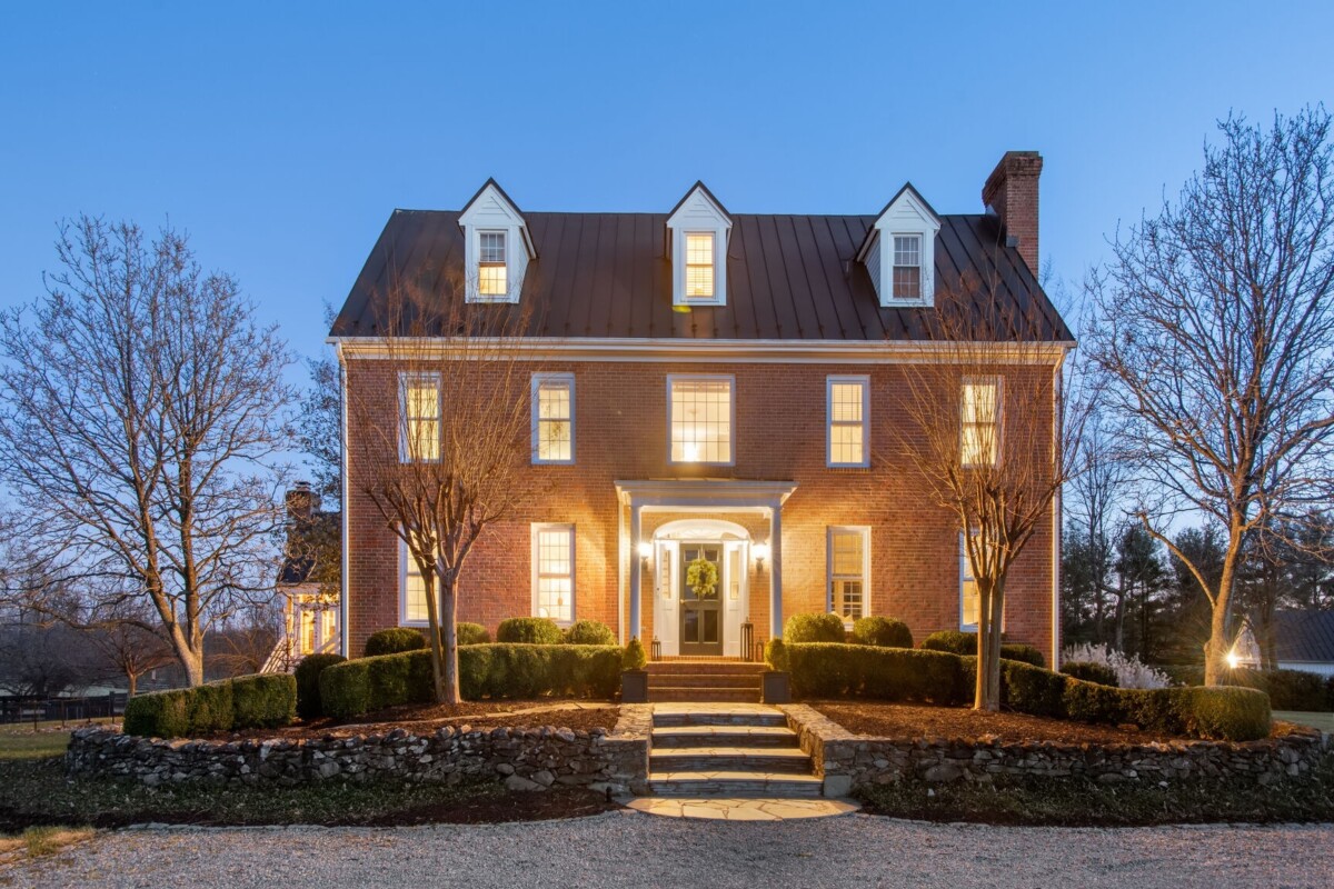 brown georgian style home at night