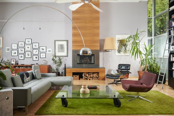 Inside, a custom wood-burning fireplace takes center stage in the main living room.