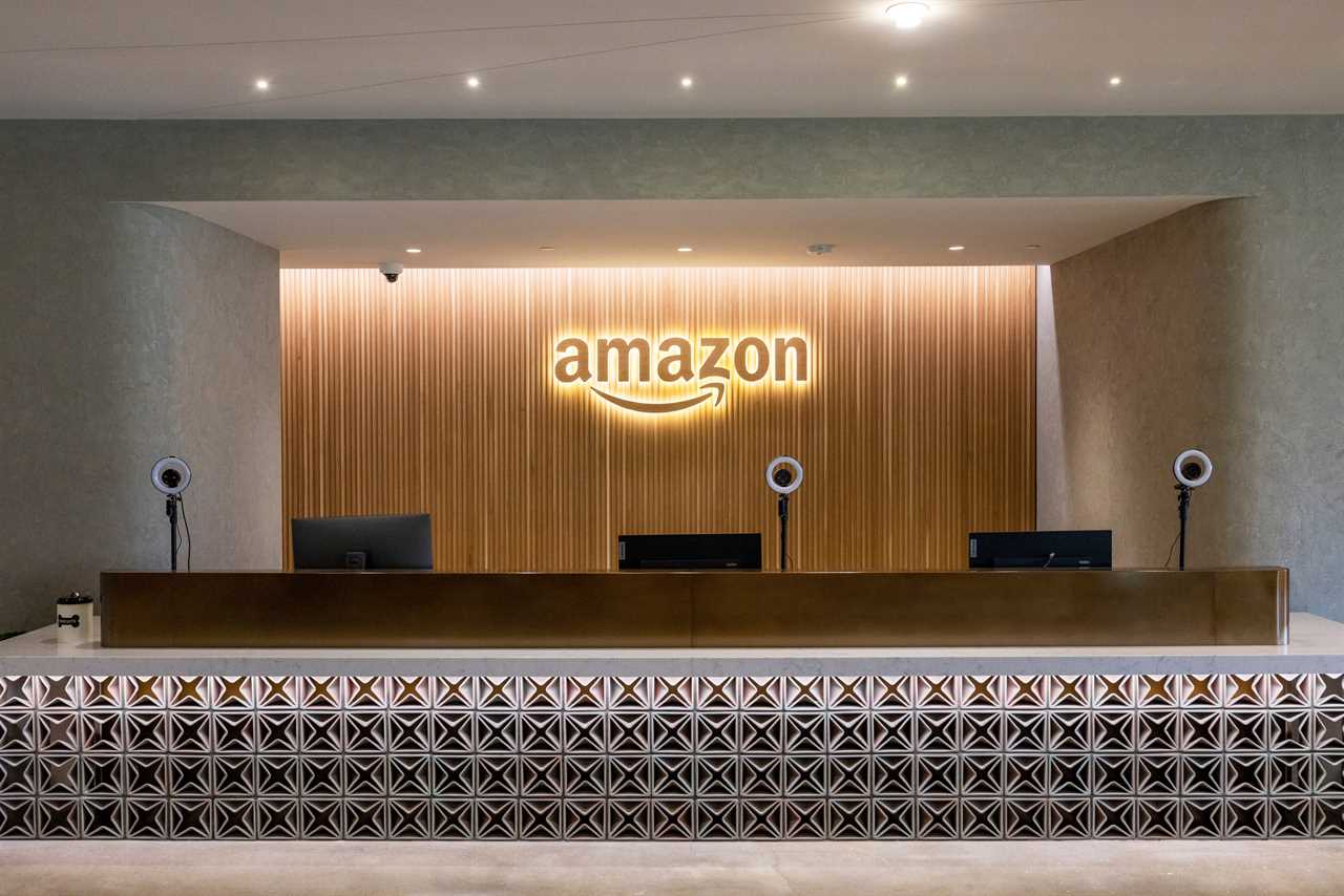 Amazon logo at a check-in reception desk at Metropolitan Park, the first phase of Amazon's HQ2 second headquarters in Arlington, Virginia