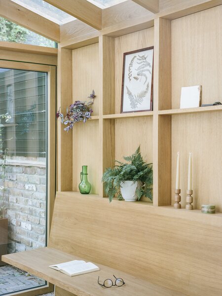 "On our first site visit, the client showed us a large Welsh dresser which was used for display. While we couldn’t find room for it in the lower ground floor, we did manage to reinterpret it’s functionality as a wall of oak shelving used for storage and display.