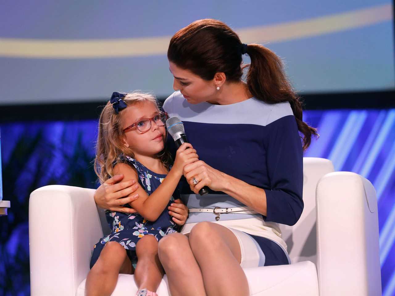 Madison DeSantis sits with Casey DeSantis at an event