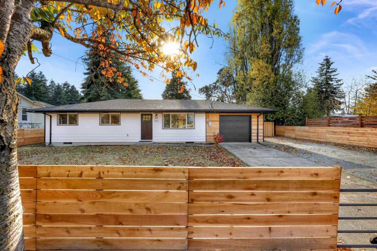 ranch home with wood and white siding